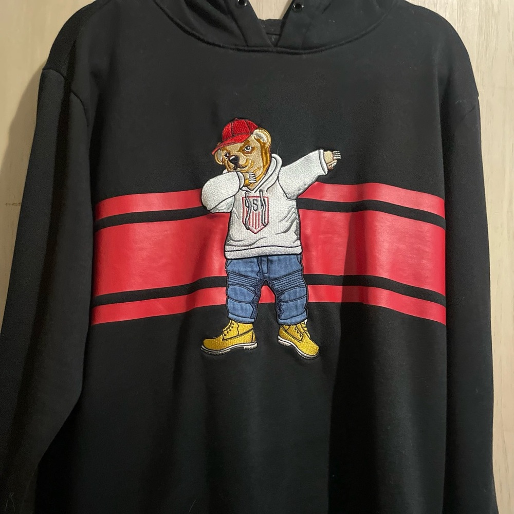 Trendy Black Sweater with Red Stripe and Bear Design